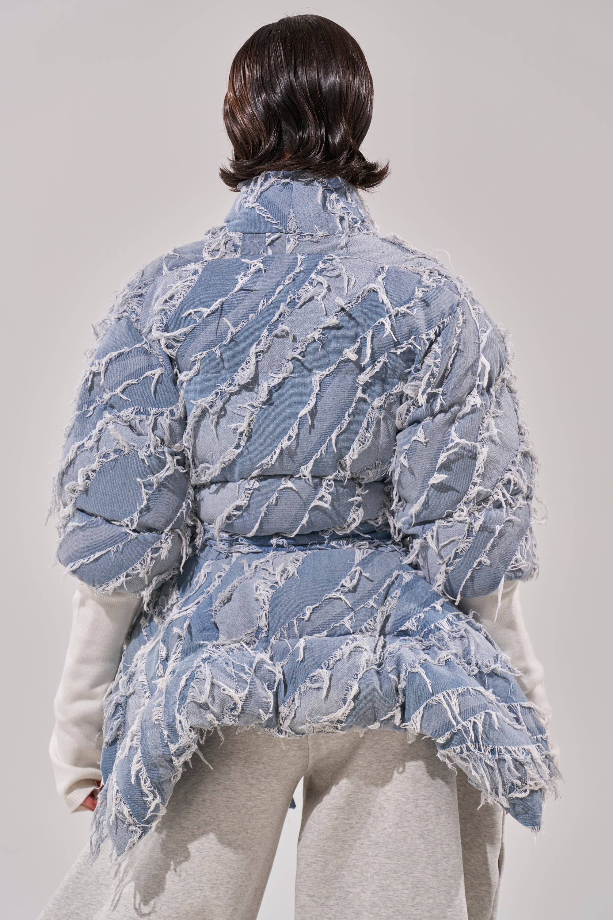 RIB SLEEVE PEPLUM PUFFER IN DENIM
