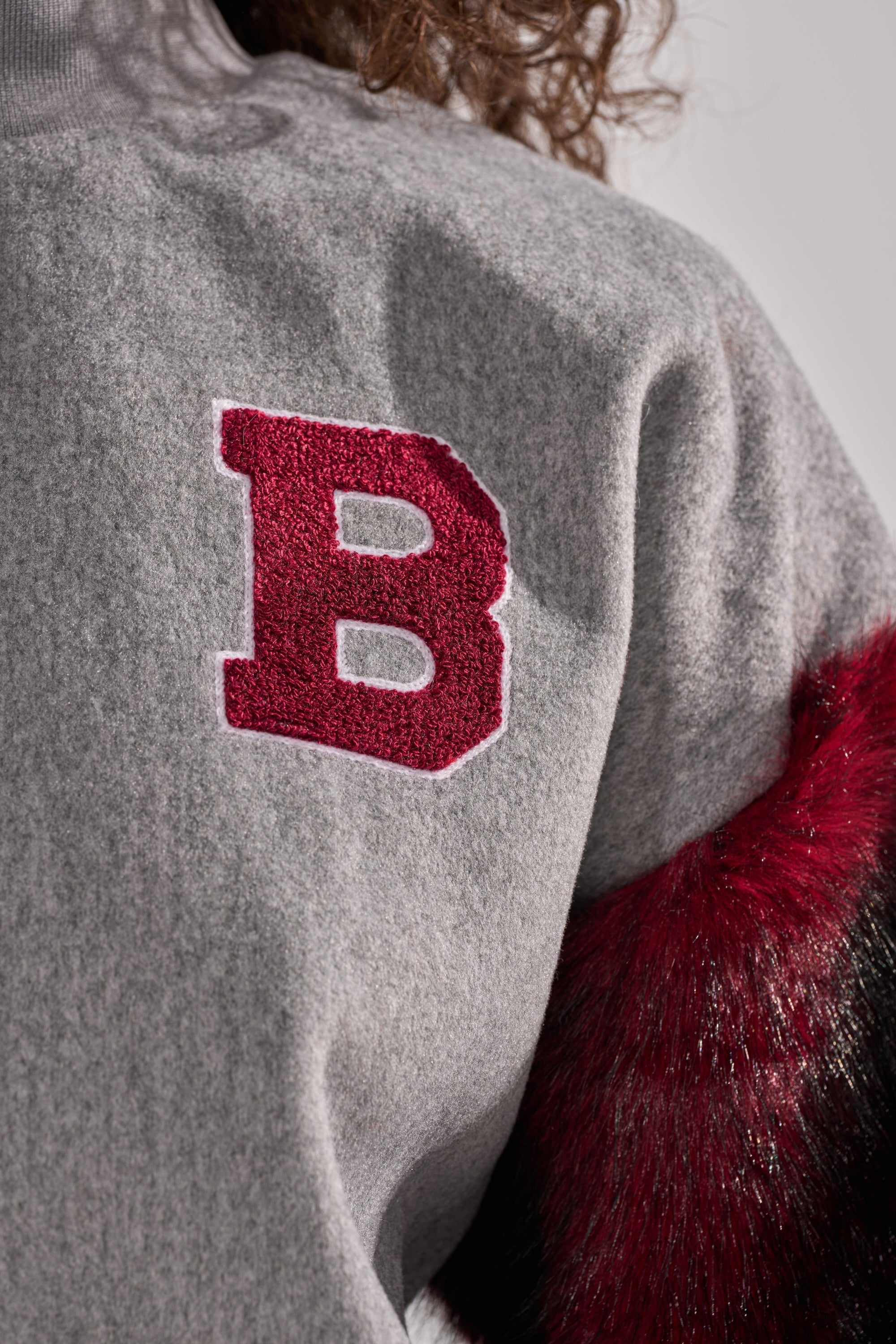 NEW EAST SIDE FAUX FUR SLEEVE SWEATSHIRT